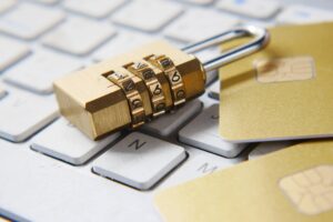 padlock laying on top of laptop keyboard for secure digitisation