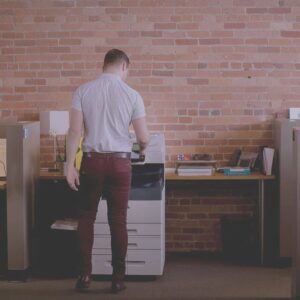 man using a photcopier